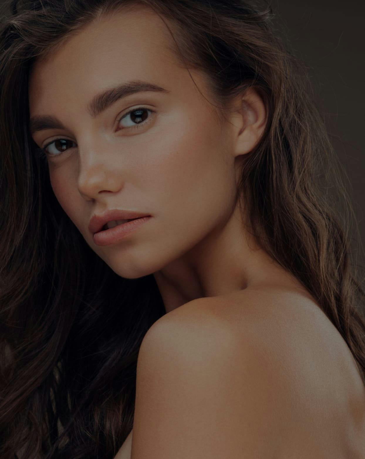 Model posing and looking over her shoulder at the camera.